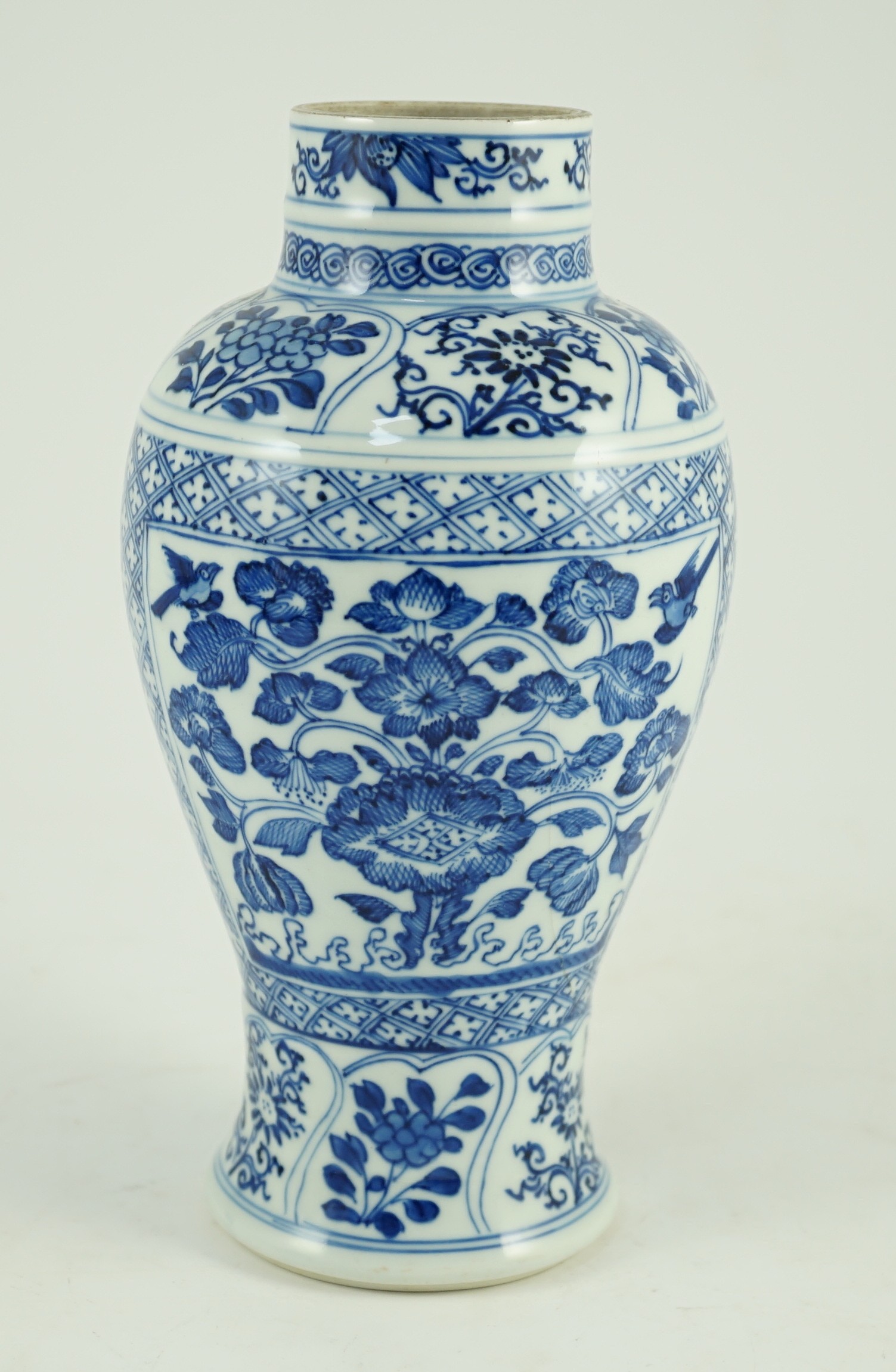 A Chinese blue and white vase, Kangxi period, 21cm high, hairline crack to neck